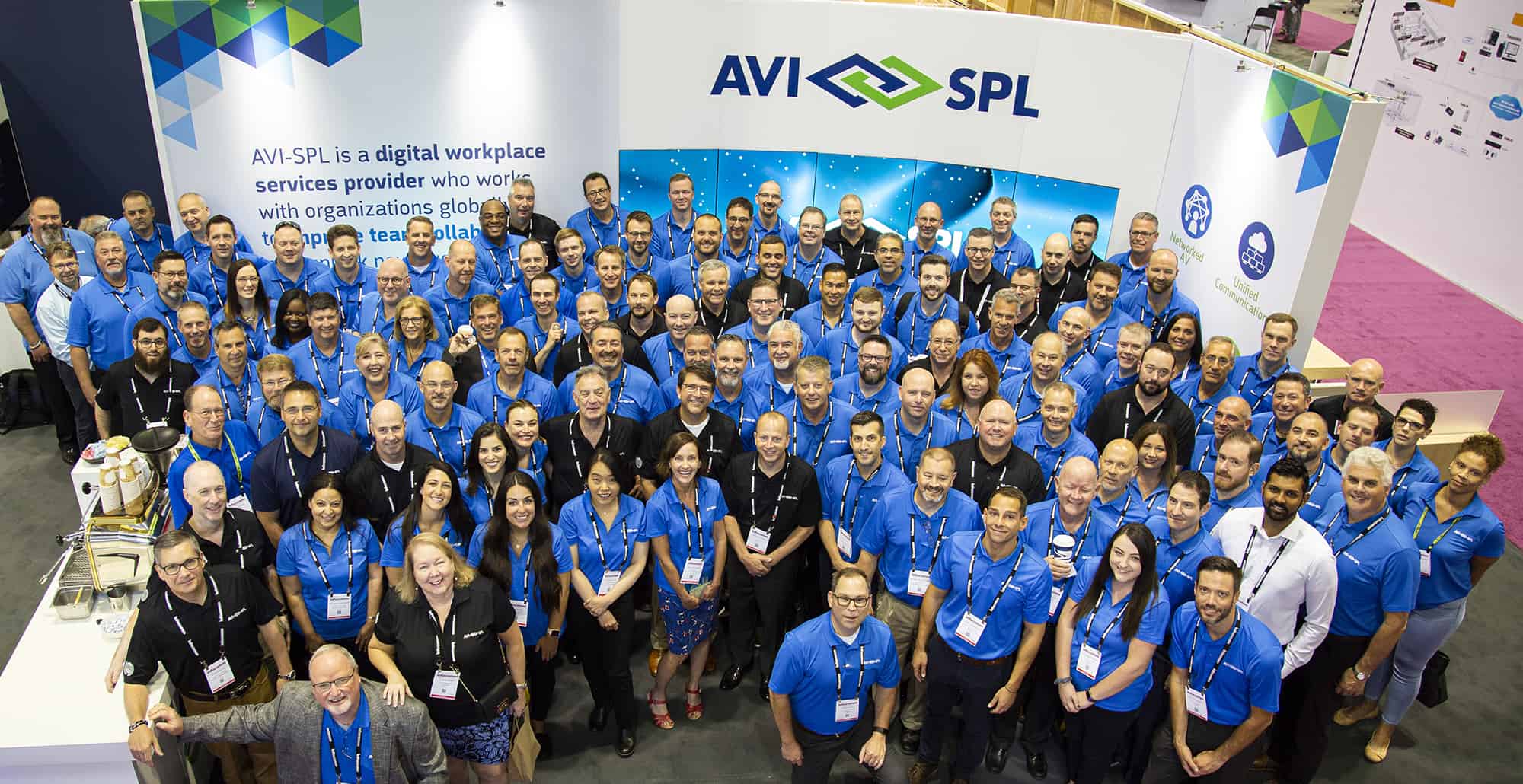 AVI-SPl team at tradeshow booth