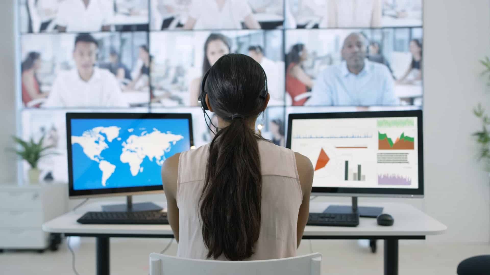 woman at desk using global remote collaboration technology