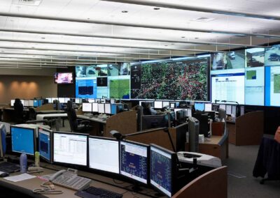 Large monitoring station with multiple monitors and a large video wall