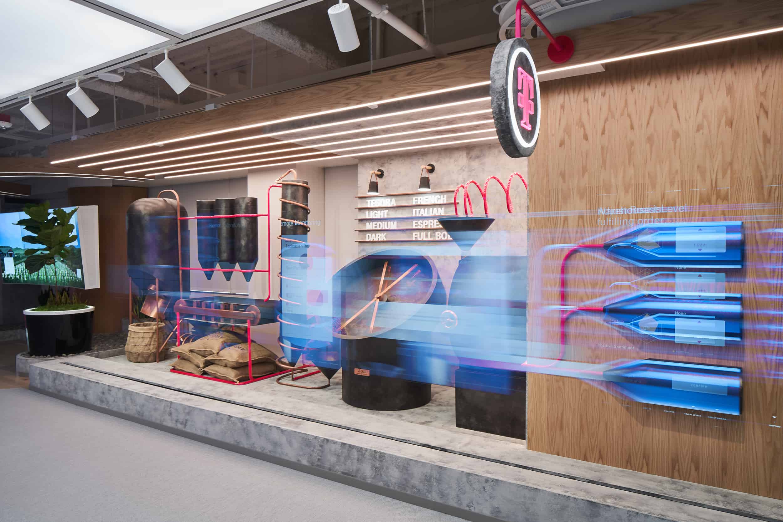 Modern display features a coffee roasting process with labeled levels, beans, and equipment; vibrant design with blue/pink accents.