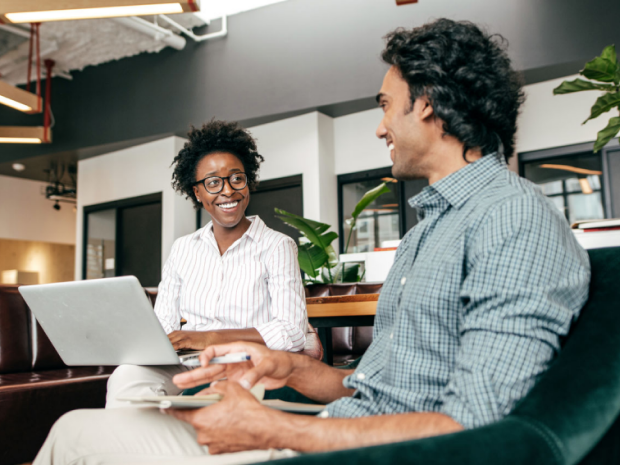 Two people using Microsoft Copilot in a meeting